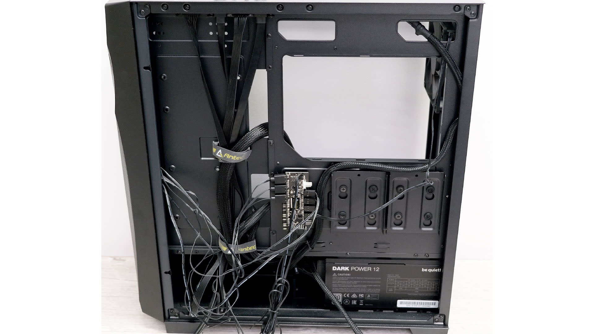 Power supply cables routed behind the motherboard tray of a self-built PC