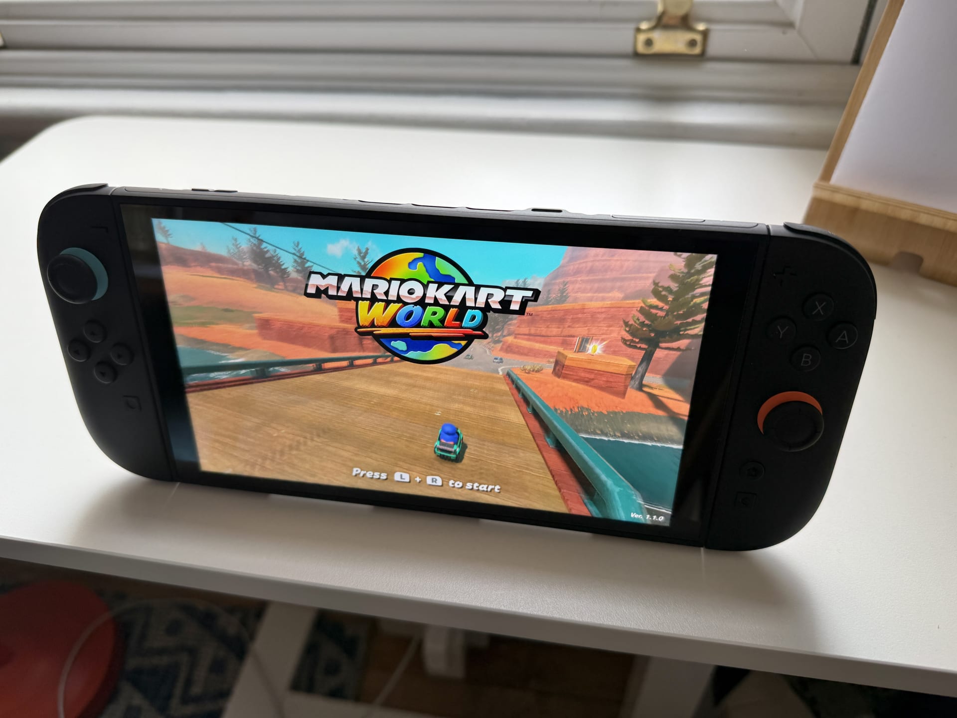 Nintendo Switch 2 console held in handheld mode with Joy-Con controllers attached