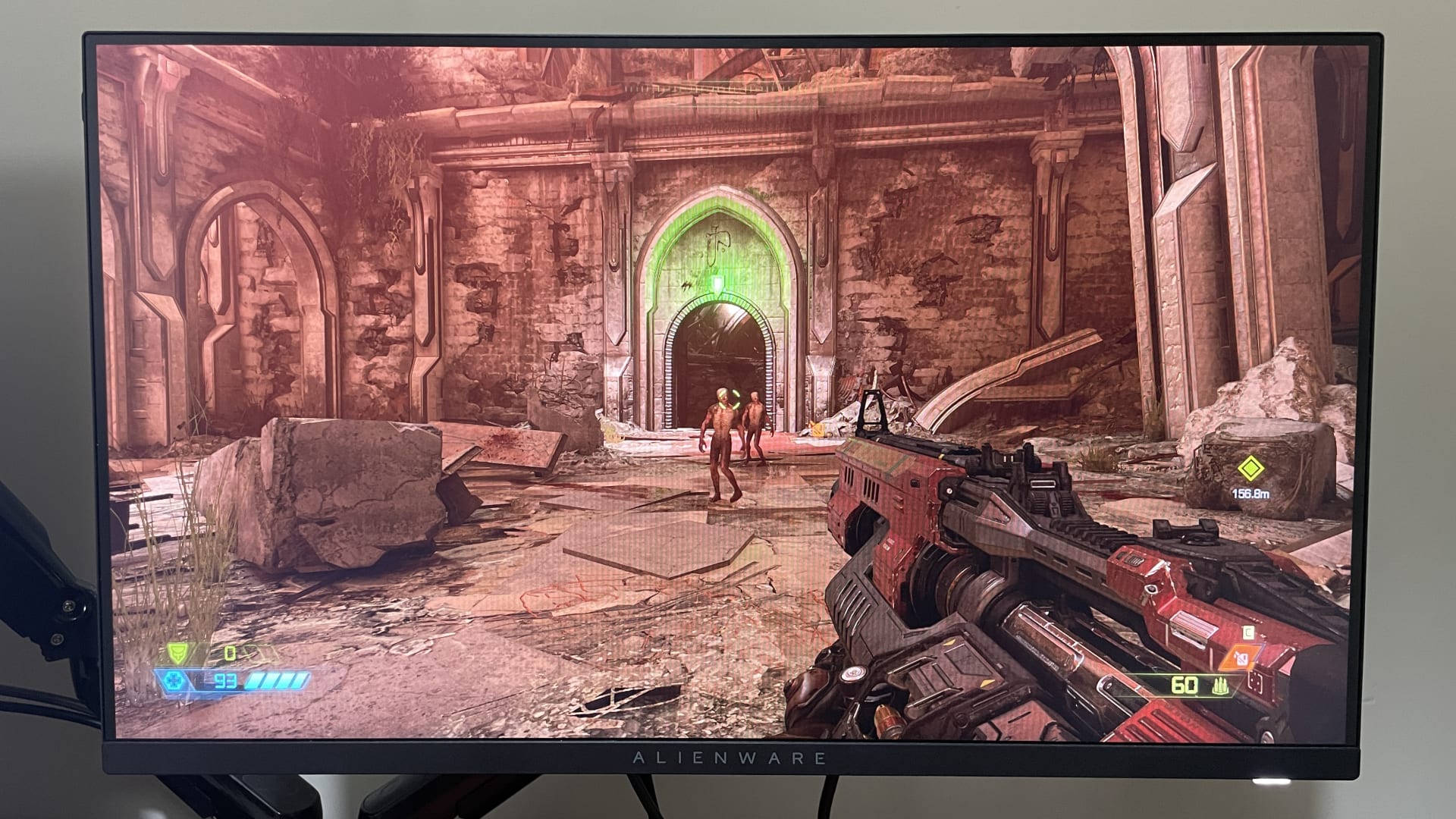 A gaming monitor displaying an HDR scene with bright specular highlights against dark background detail