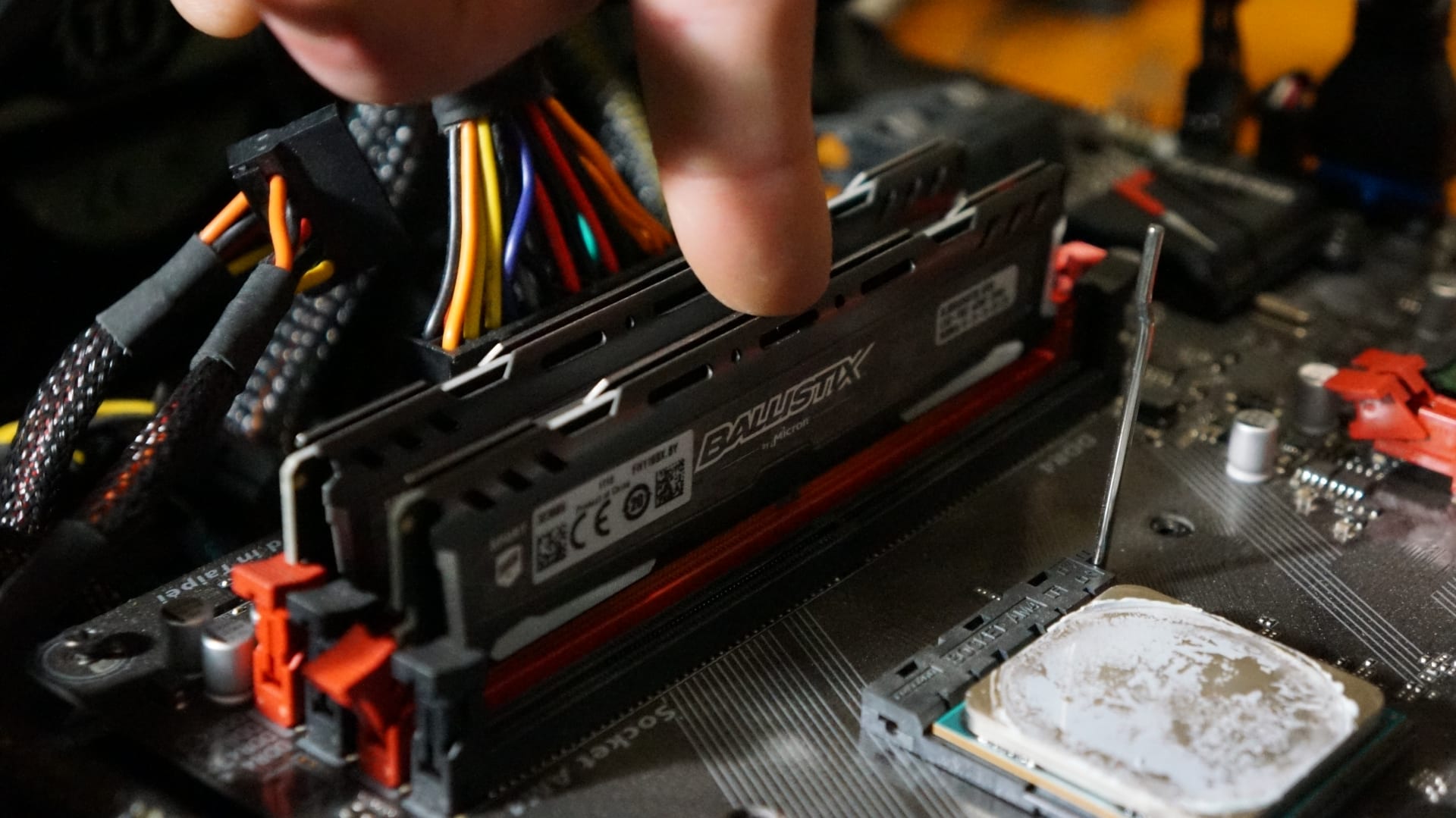 Memory modules being seated into the DIMM slots on a motherboard