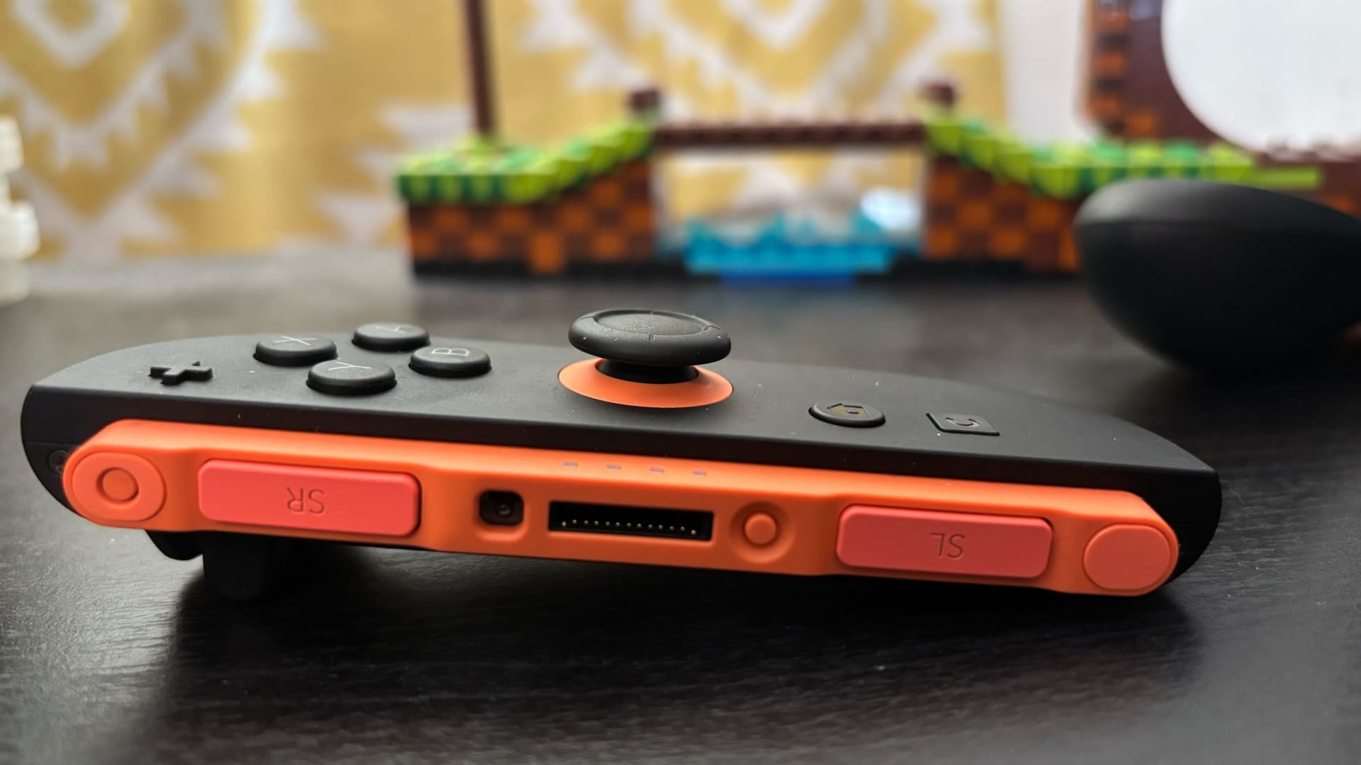 Close up of a Joy-Con analog thumbstick and the surrounding bezel on a Switch 2