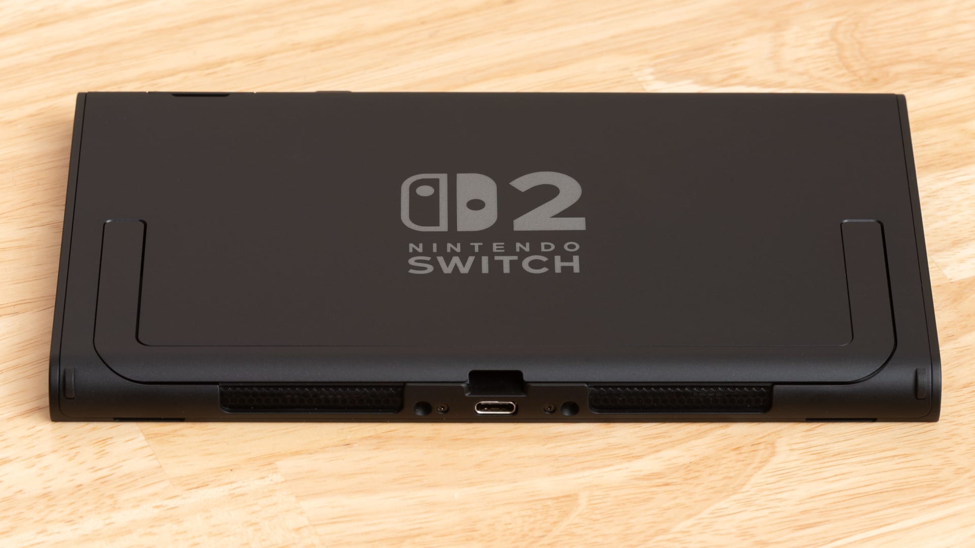 A Nintendo Switch 2 in handheld mode with the screen powered on