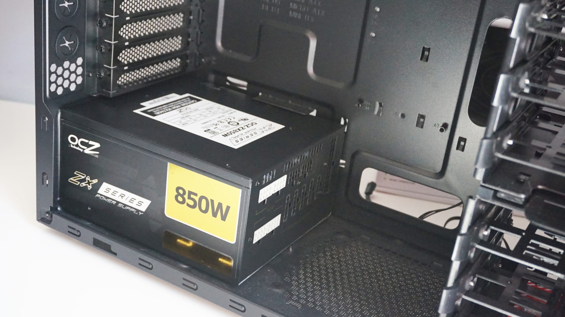 An 850W ATX power supply mounted in the base of a gaming PC case