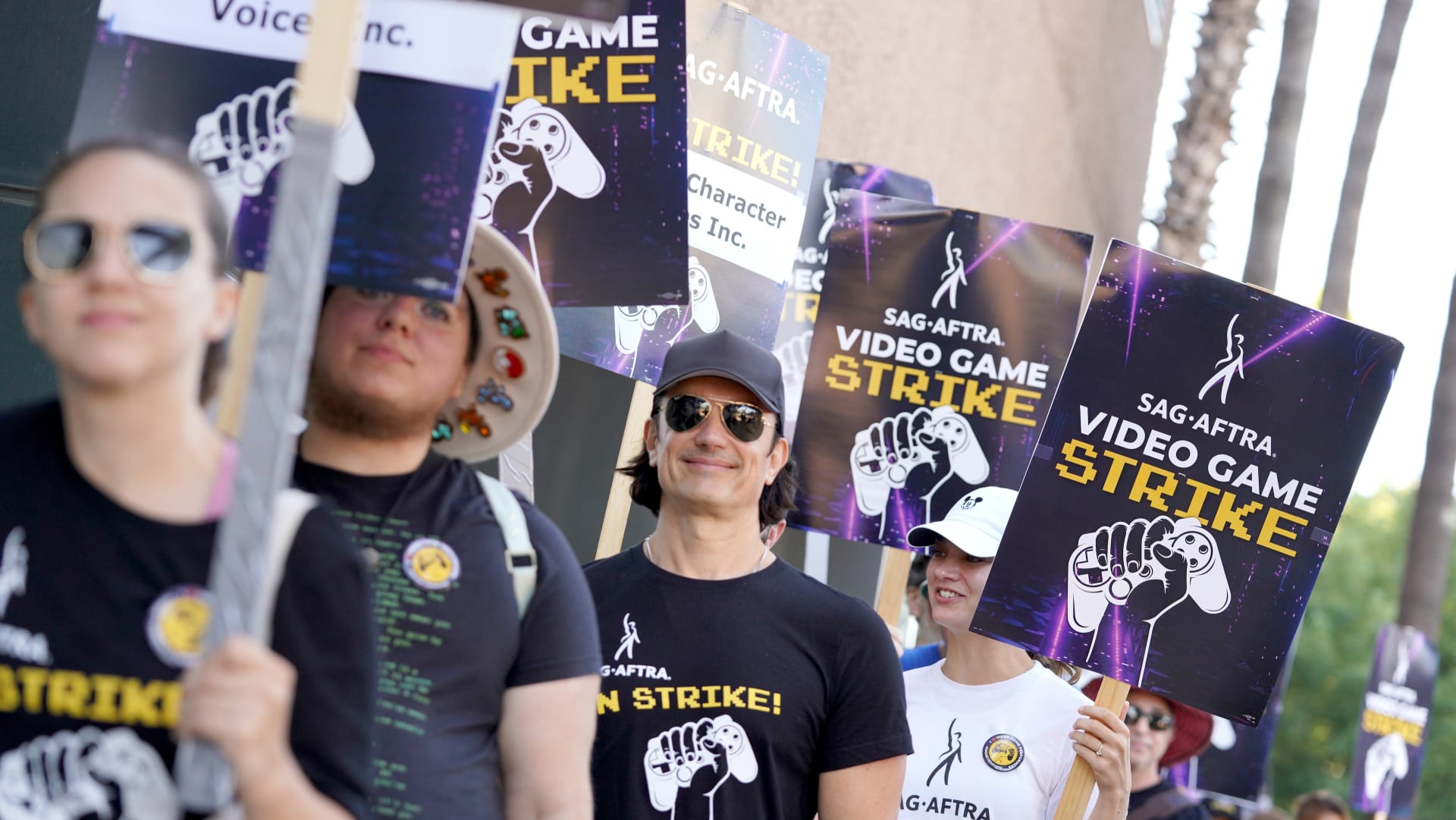 Performers on a picket line holding SAG-AFTRA Video Game Strike signs during the 2024-2025 video game strike