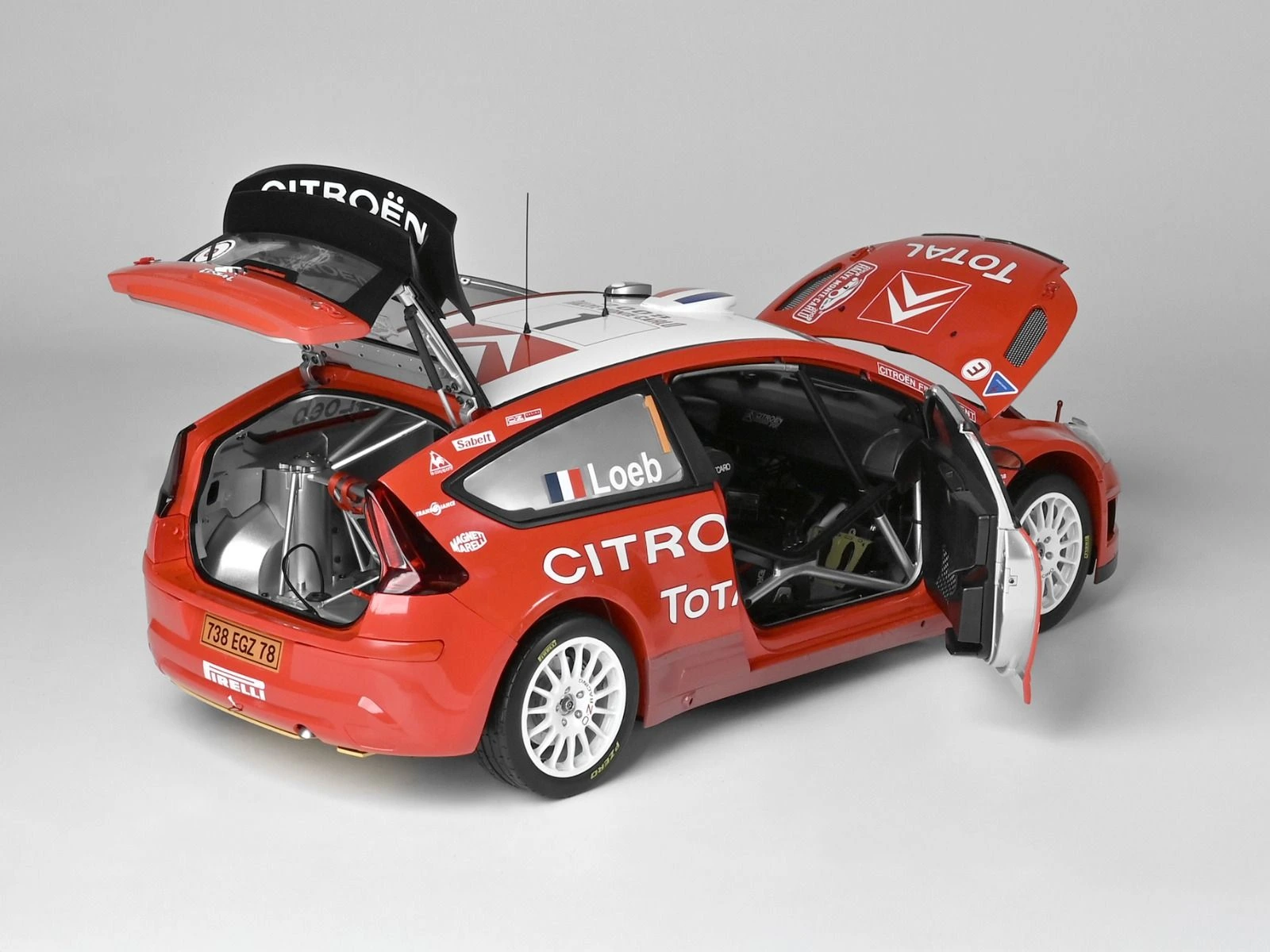 Rear view, with doors, boot and bonnet open, of an assembled Citroën C4 WRC 2008 1/8 scale model