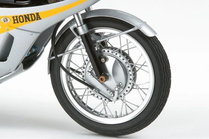 Close-up view of the front tyre of an assembled Honda RC166 GP Racer 1/12 scale model