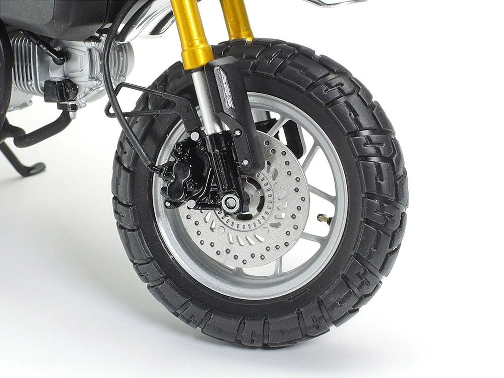 Close-up view of the front tyre of an assembled Honda Monkey 125 1/12 scale model