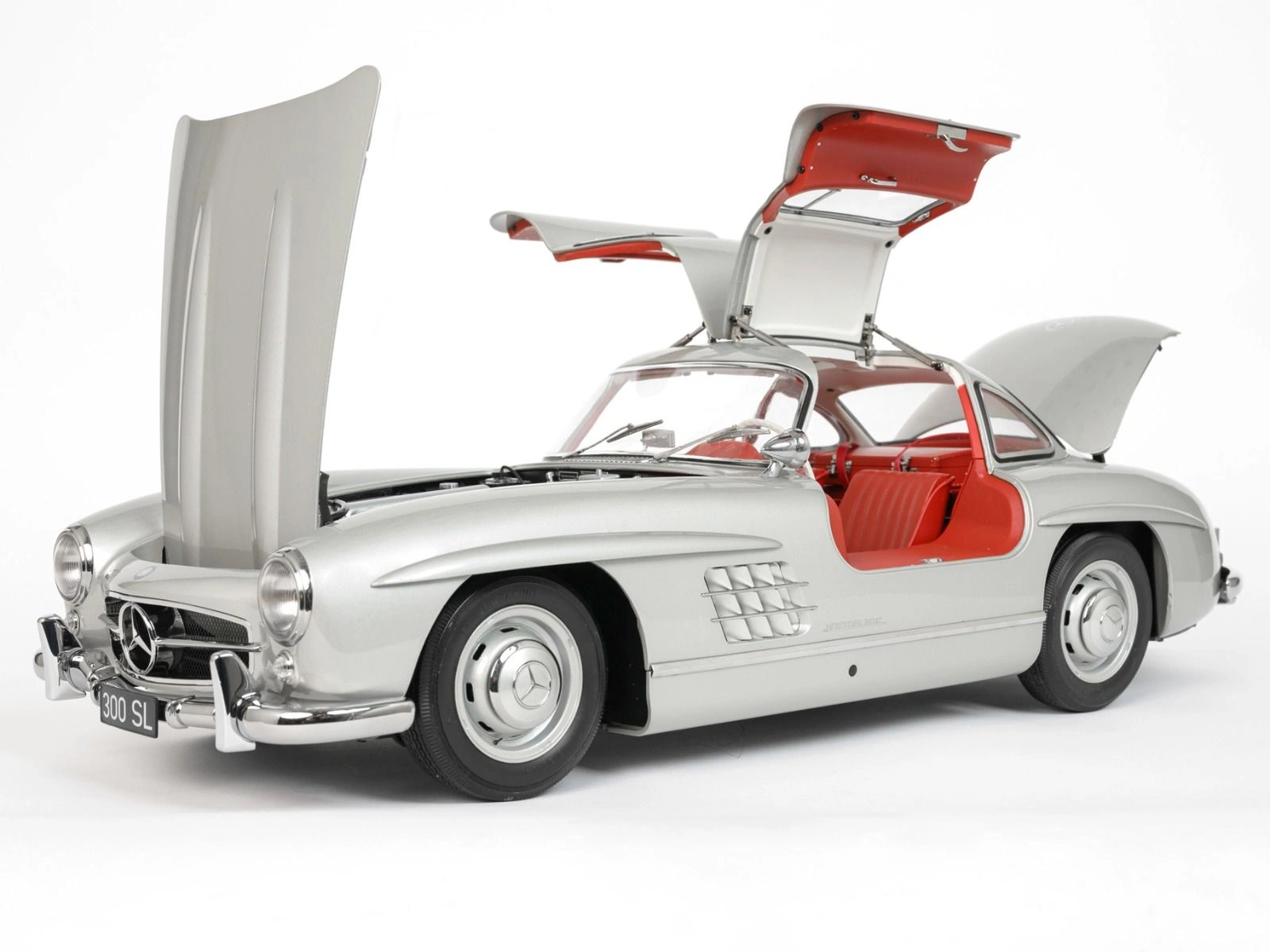 Side view of an assembled Mercedes 300 SL 1/8 scale model with doors, boot and bonnet open