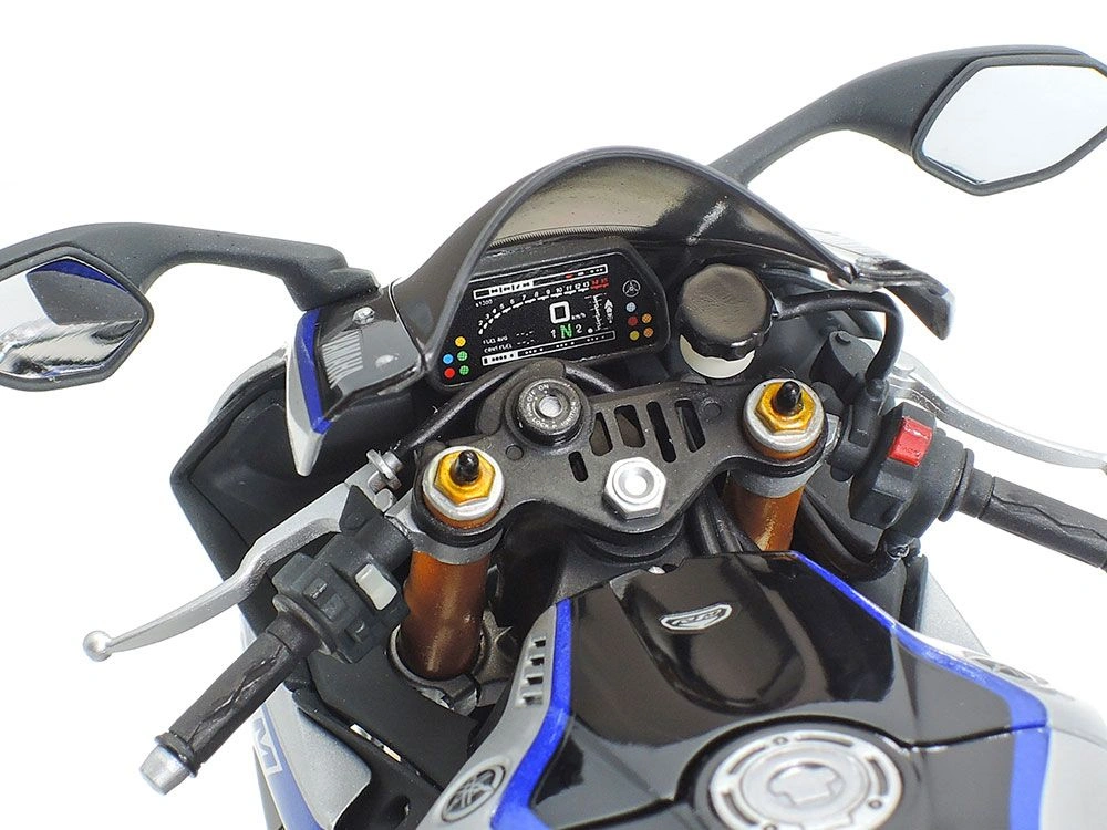 Close-up view of the handlebars and dashboard of an assembled Yamaha YZF-R1M 1/12 scale model