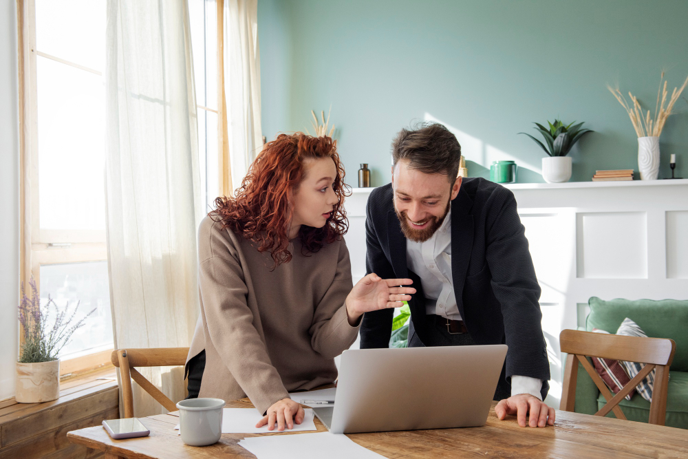 Married couple reviewing paperwork together (joint property ownership)