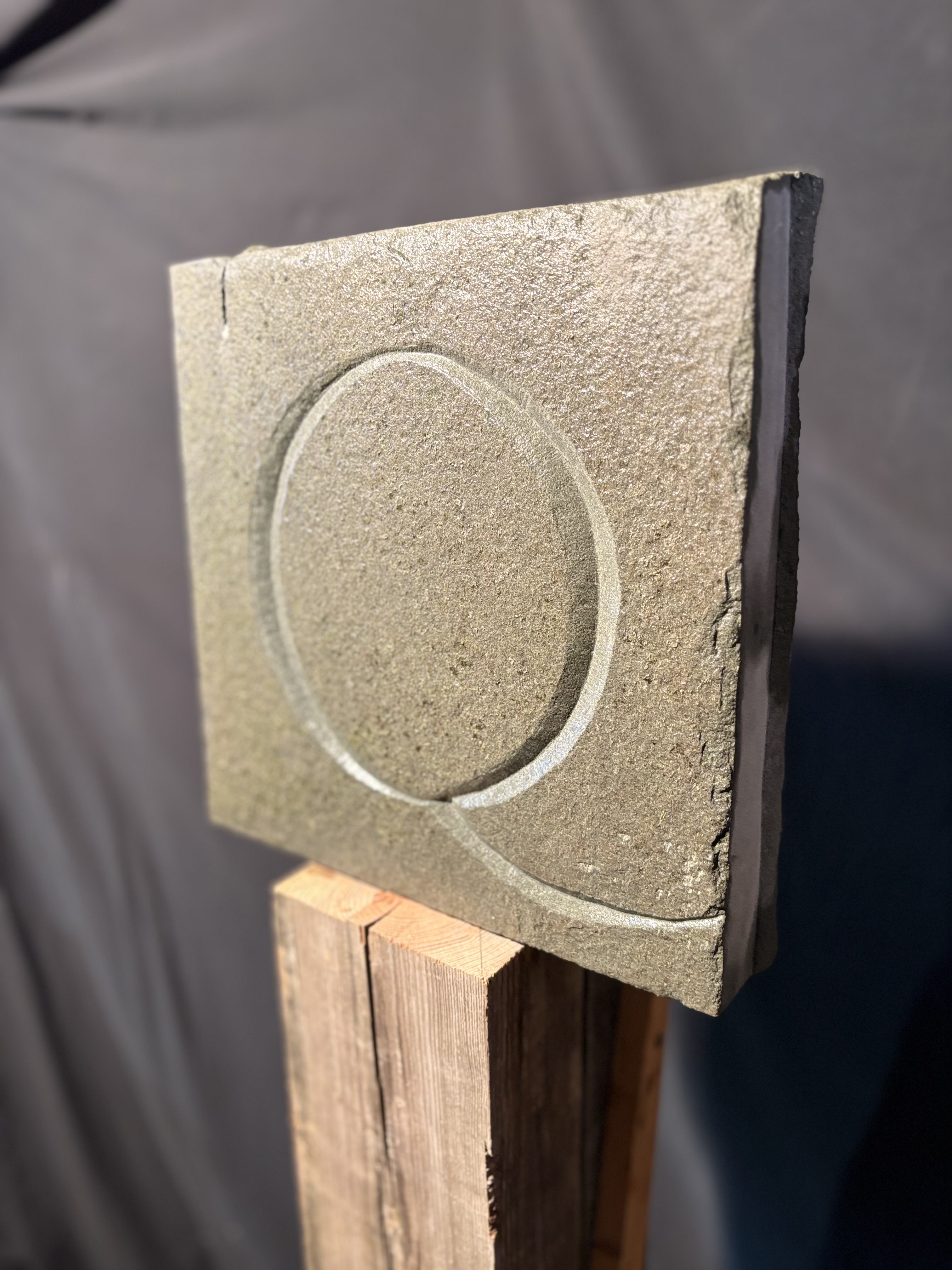 Custom carved stone letter Q — hand-chiseled lettering and signage by Dan Quinn