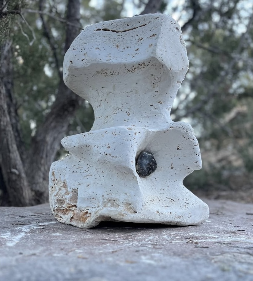 Stone sculpture in travertine with embedded obsidian inlay, by Dan Quinn, Genesee Valley Stone Works