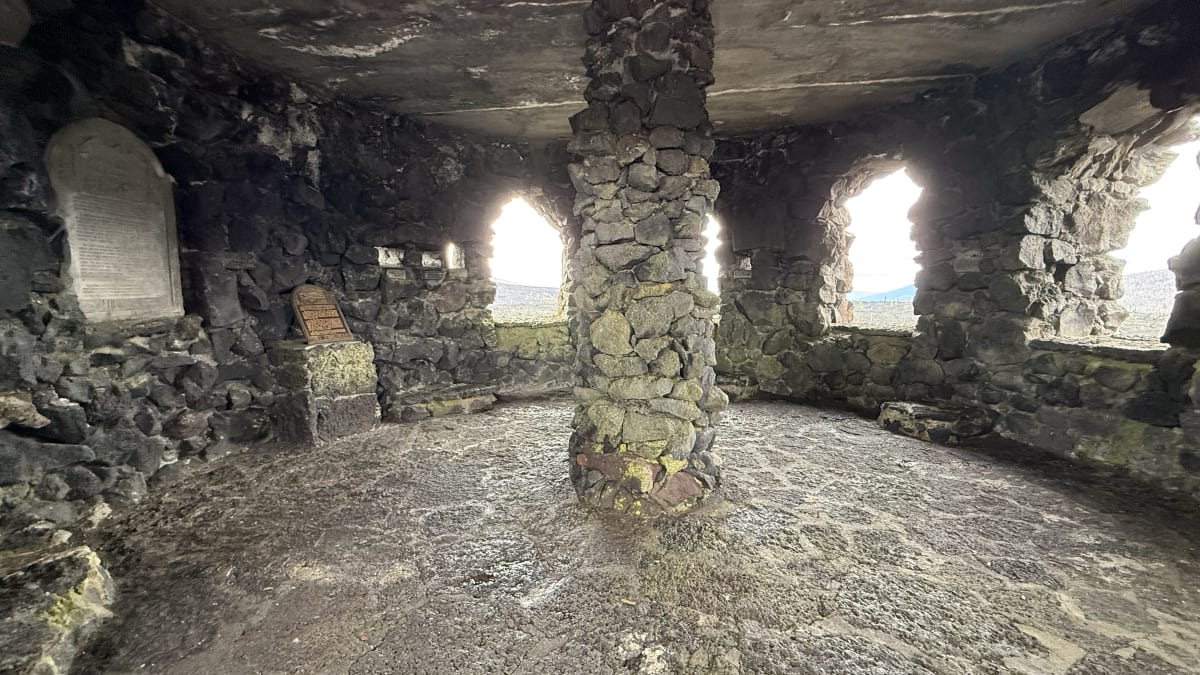 The arched stone windows inside the Dee Wright Observatory