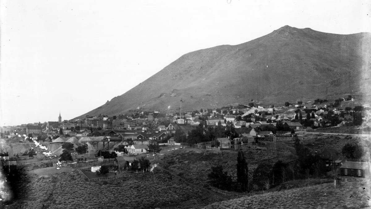 A historic panorama of the Comstock silver-mining town of Virginia City, Nevada, below Mount Davidson