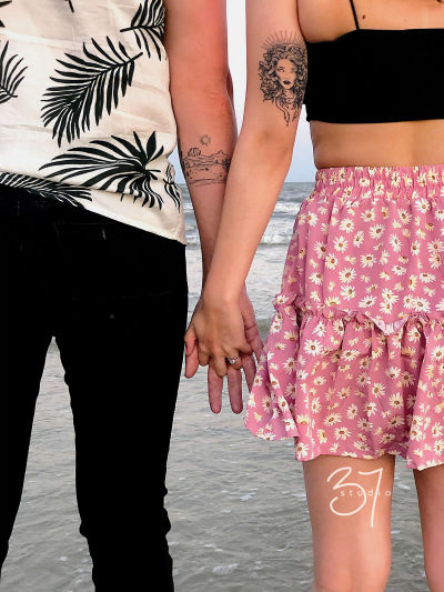 Happy couple Alex and Logan embrace during their romantic engagement photography session in Pinehurst, TX.
