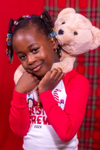 Joyful EseOtobo family portrait, captured by a professional photographer in Pinehurst, TX.