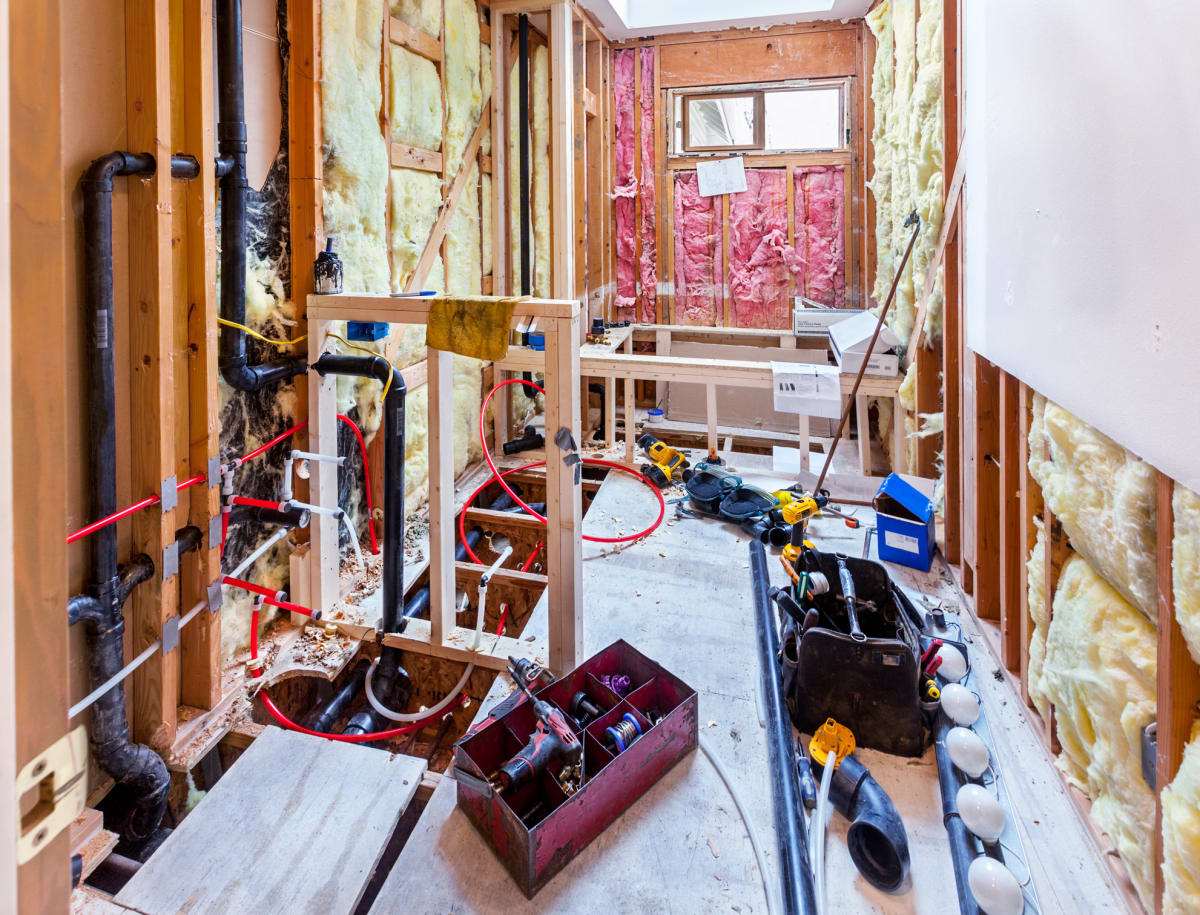 Rough-in plumbing and electrical during a HousePro bathroom remodel