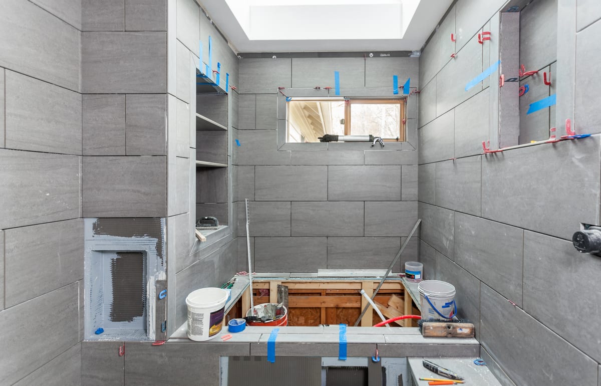 Tile, flooring, and fixture installation during a HousePro bathroom remodel