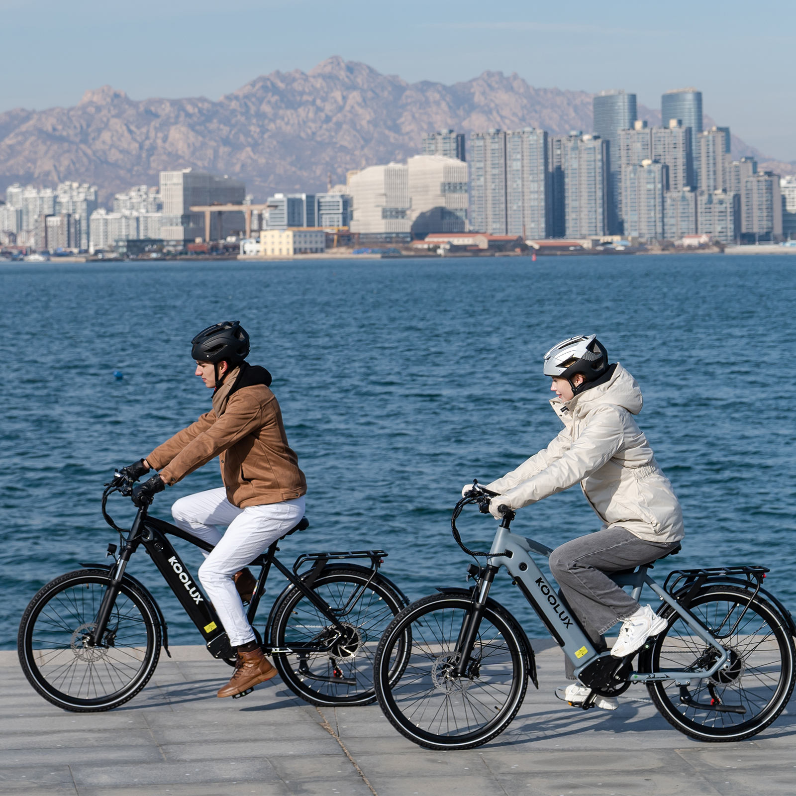KOOLUX X3 Commuter Electric Bike male and female riding on beach