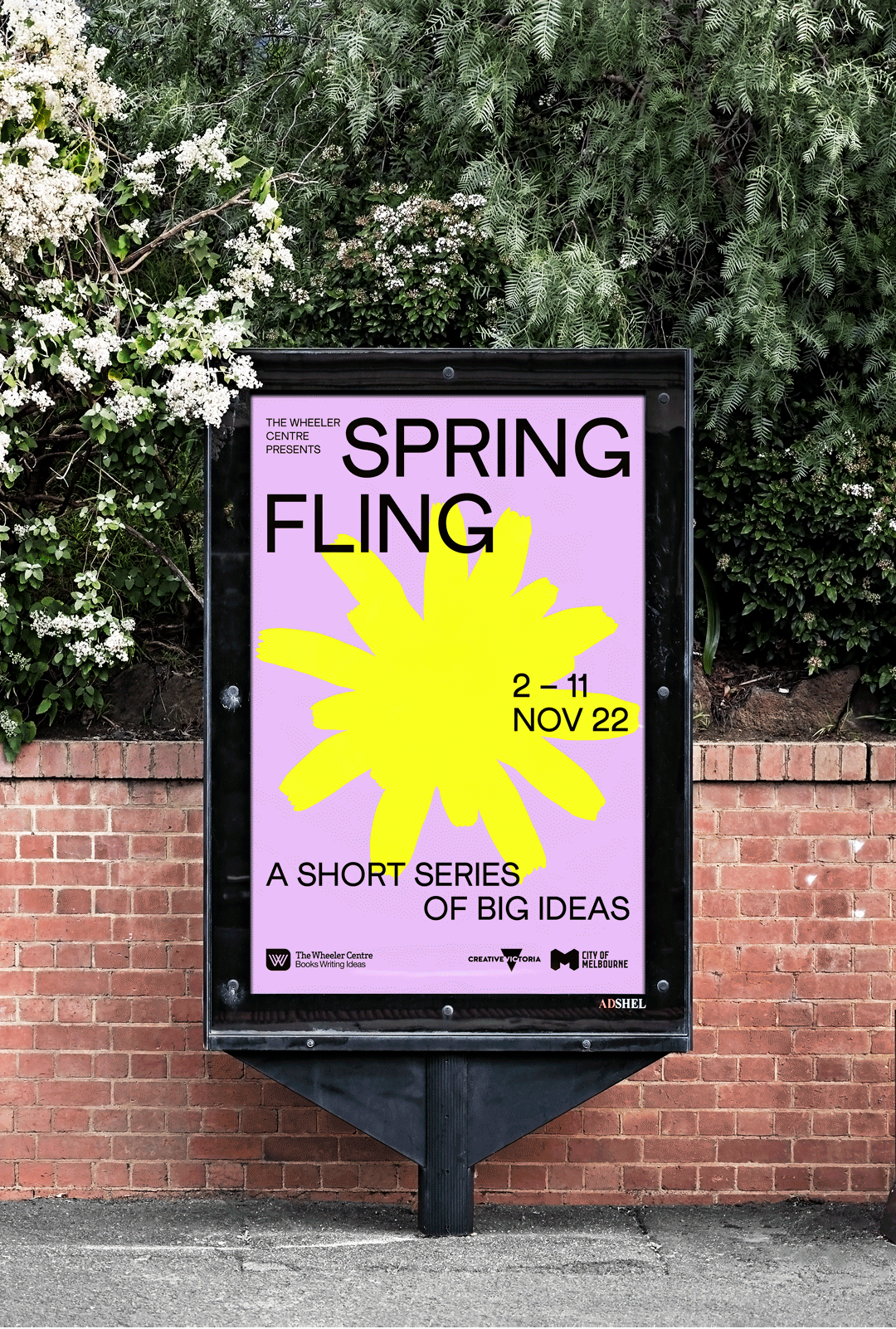 A bright graphic billboard on a train station platform in Armadale, Melbourne.