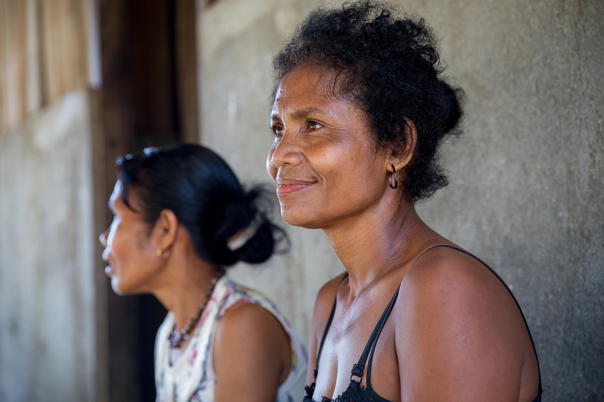 Woman smiling into distance in Timor Leste