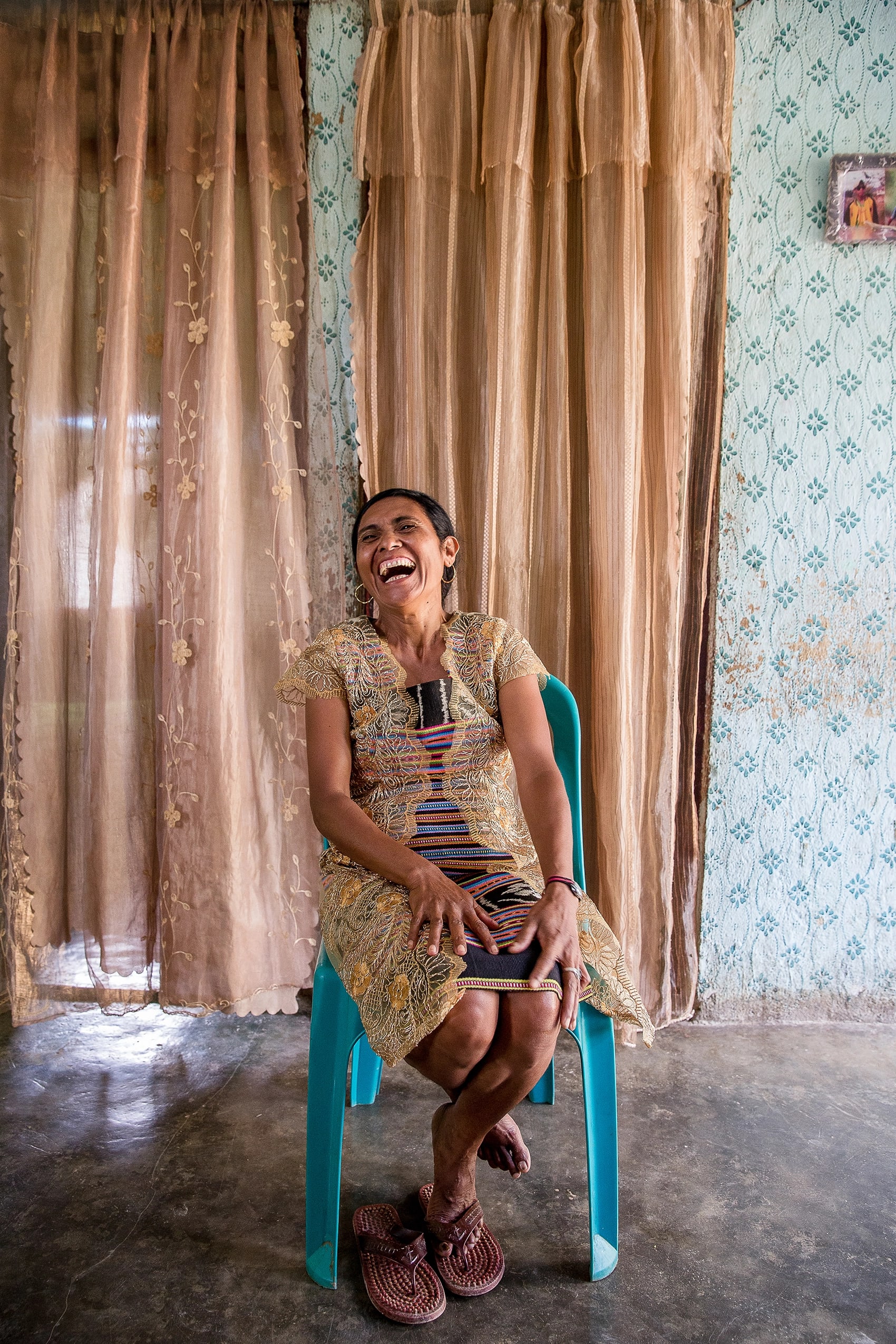 Woman laughing in chair