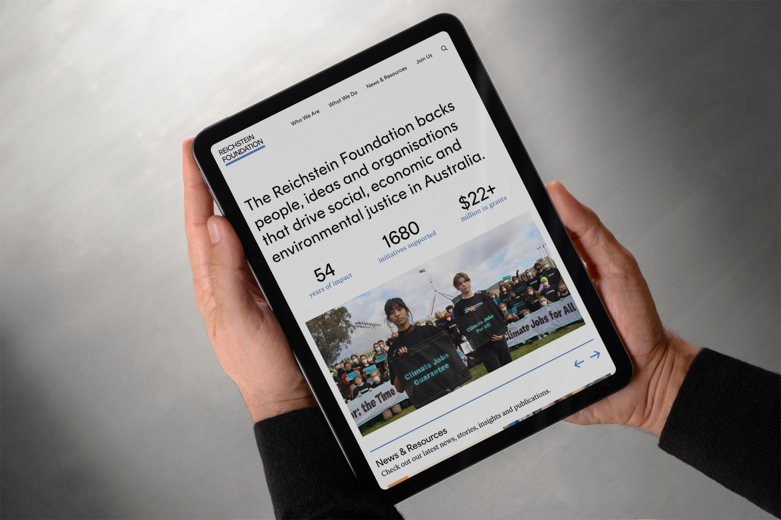 Man holding Ipad with Reichstein Foundation Website