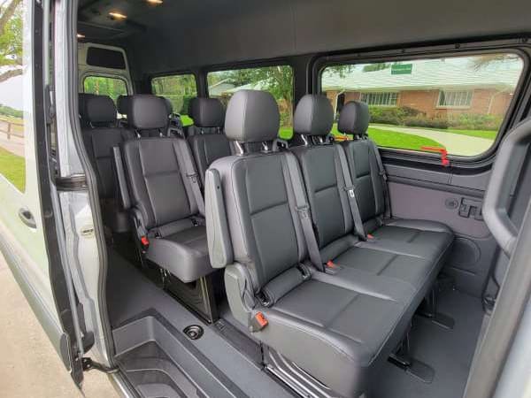 Luxury Sprinter van exterior at a private airport terminal