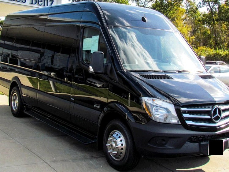 Executive team arriving at a corporate retreat in an A1CHARTERS Sprinter van