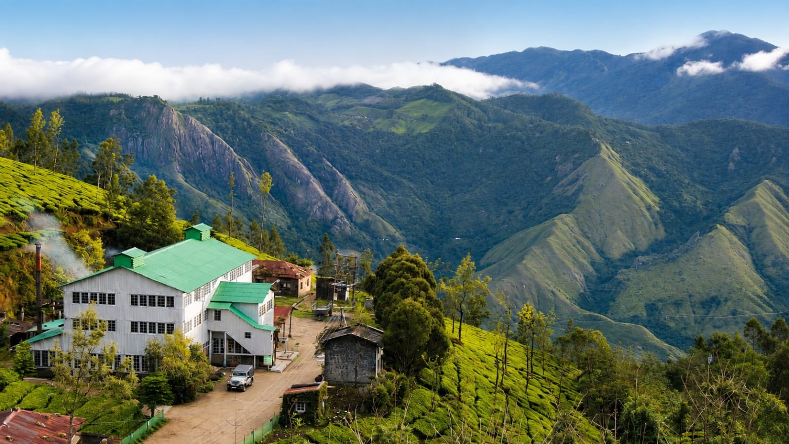 Kolukkumalai Tea Estate with rolling tea plantations and mountain views in Munnar, Kerala