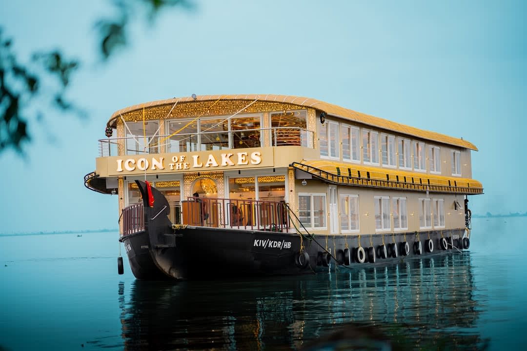 tourists relaxing on upper deck of alleppey houseboat