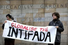 Pro-Hamas protestors holding a banner that reads 'Globalise the Intifada'