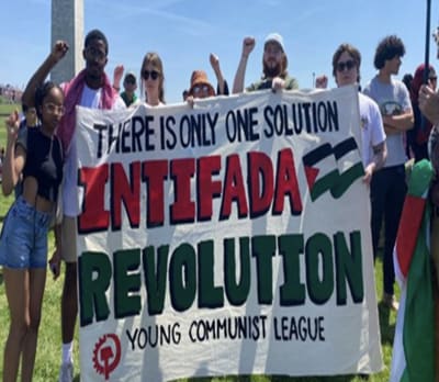 Protestors from the Young Communist League holding a sign that reads "There is only one solution - intifada revolution"