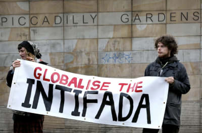 Protestors holding a sign that reads "Globalise the Intifada"