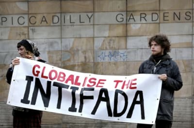 Pro-Hamas protestors holding a banner that reads 'Globalise the Intifada'