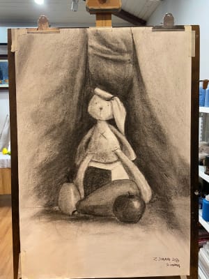 Young lady draw still life with charcoal