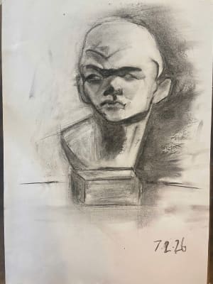 Lady studies with charcoal