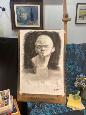 Lady studies with charcoal