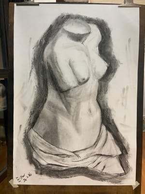 Lady studies with charcoal