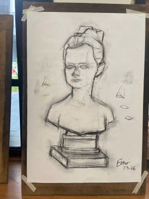 Lady studies with charcoal