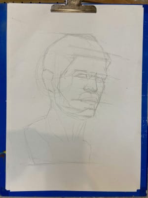 Young man leanrt head drawing
