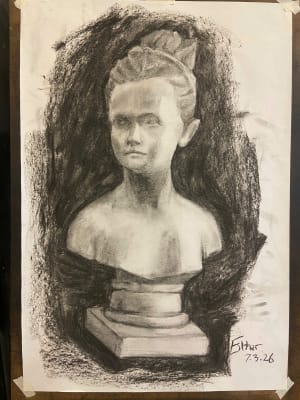 Lady studies with charcoal