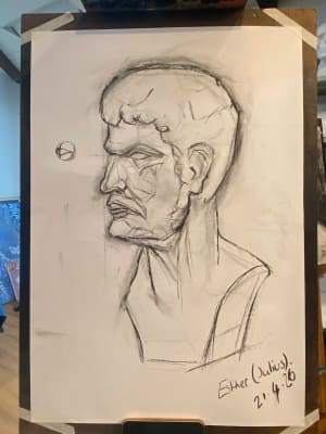 Lady studies with charcoal