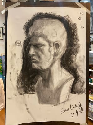 Lady studies with charcoal