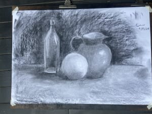Lady studies with charcoal