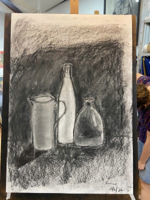 Lady studies with charcoal
