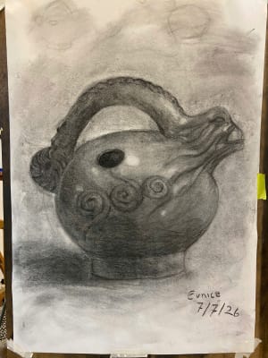 Lady studies with charcoal