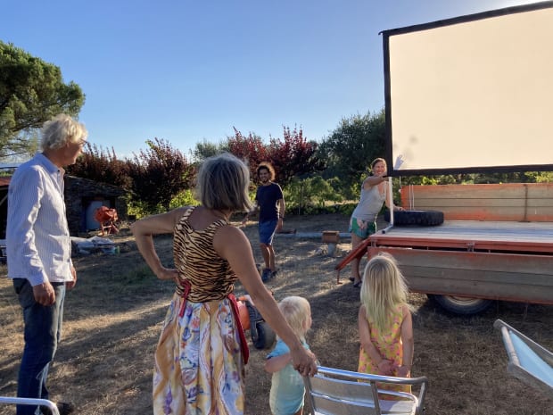 Setting up the projector screen in the sun