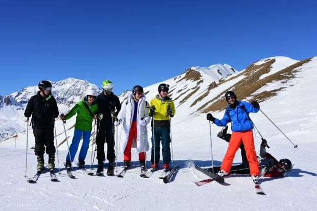 Our group posing for a photo on the slopes, apart from Paul who is on the floor