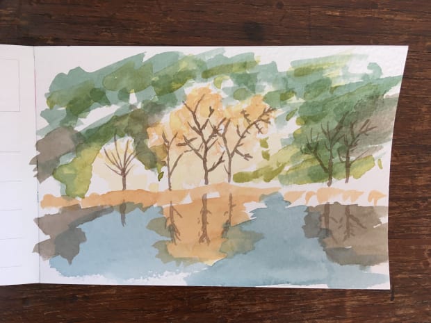A watercolour paiting of a autumn lake